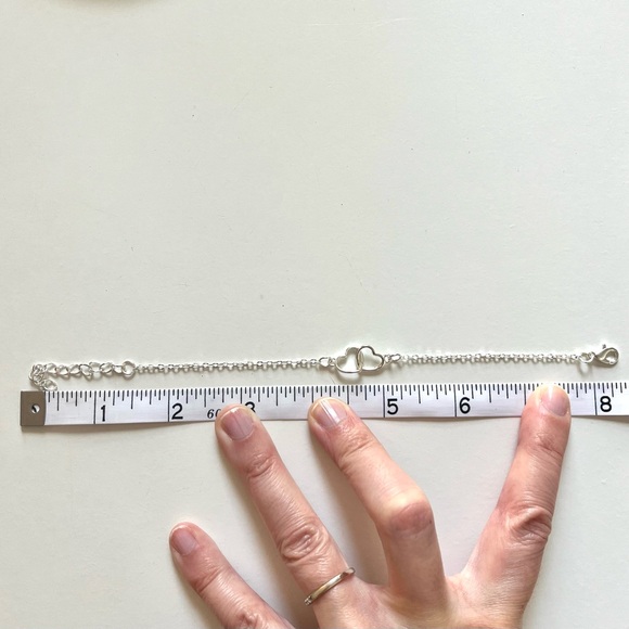 Silver Tone and Costume Jewelry Bracelet with Interlocking Hearts - Picture 3 of 3